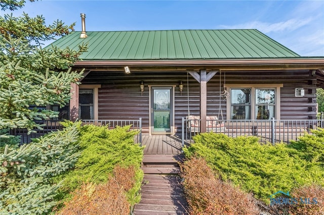 log home with covered porch