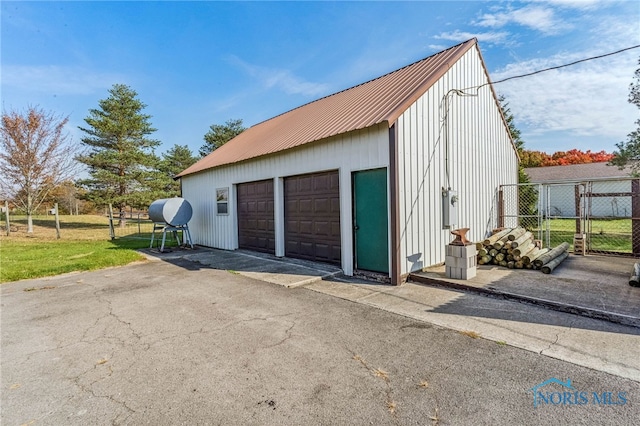 garage featuring a yard