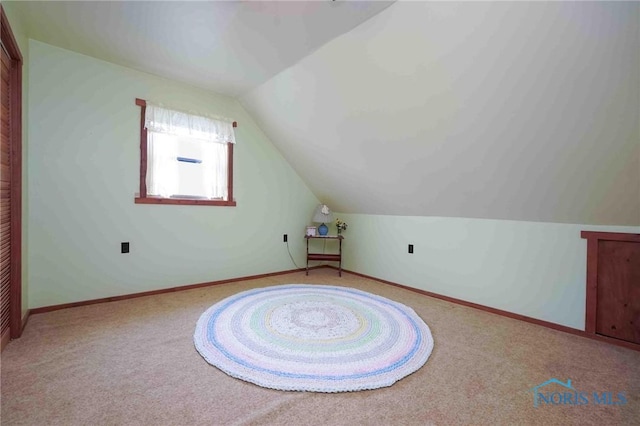 bonus room featuring carpet flooring and lofted ceiling