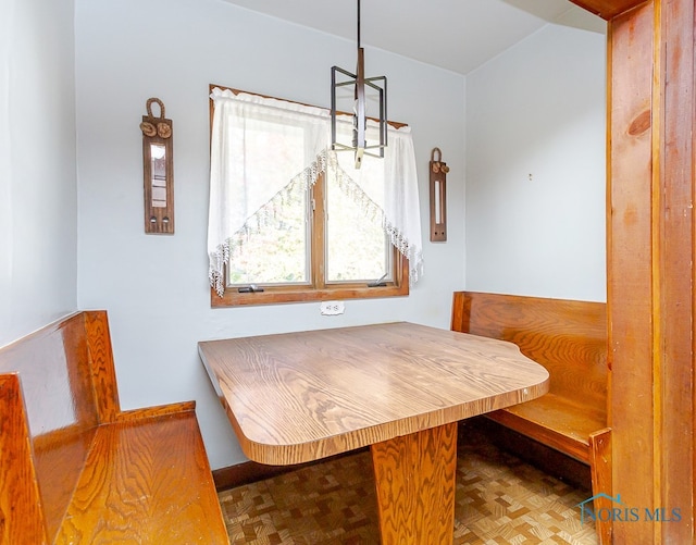 dining room featuring breakfast area and parquet floors