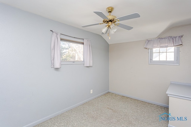 unfurnished room with light carpet, lofted ceiling, and ceiling fan