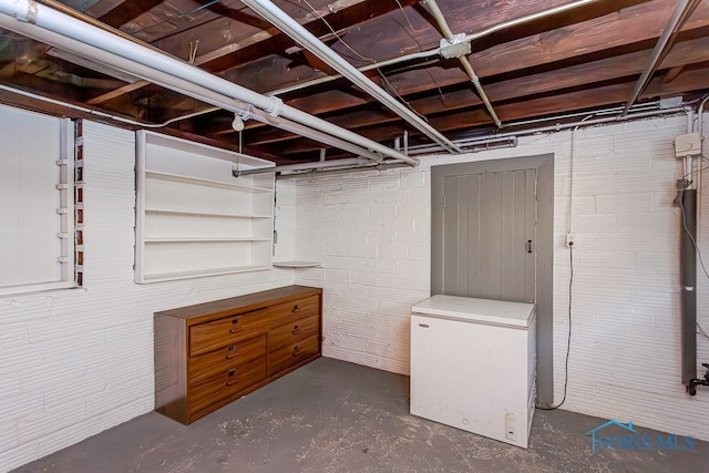 basement featuring refrigerator