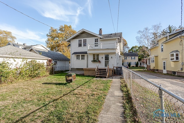 back of house featuring a yard