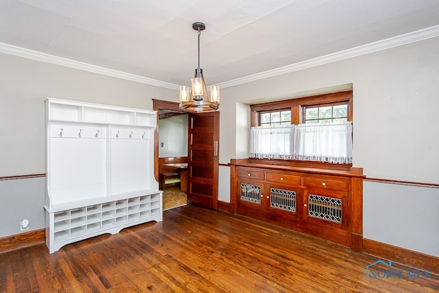 mudroom with a notable chandelier, dark wood-type flooring, and crown molding