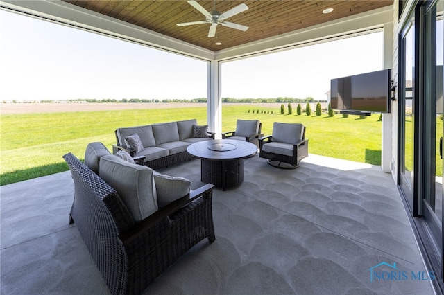 view of patio / terrace with an outdoor living space and ceiling fan