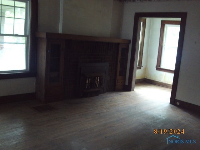 unfurnished living room featuring hardwood / wood-style floors