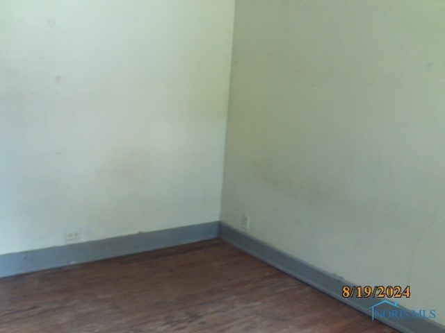 unfurnished room featuring hardwood / wood-style floors