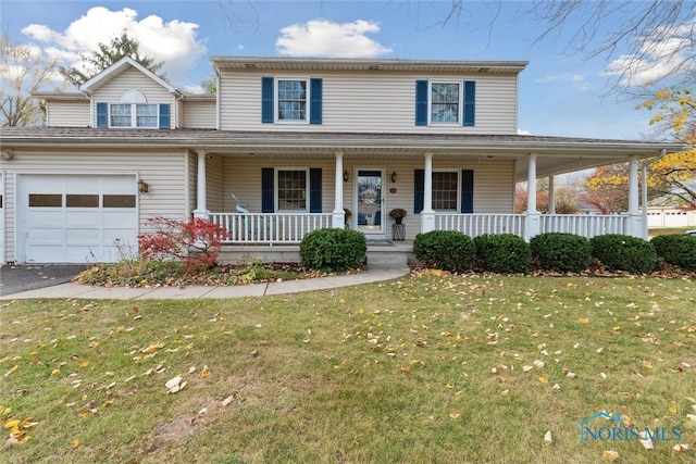 farmhouse-style home with a garage, covered porch, and a front yard