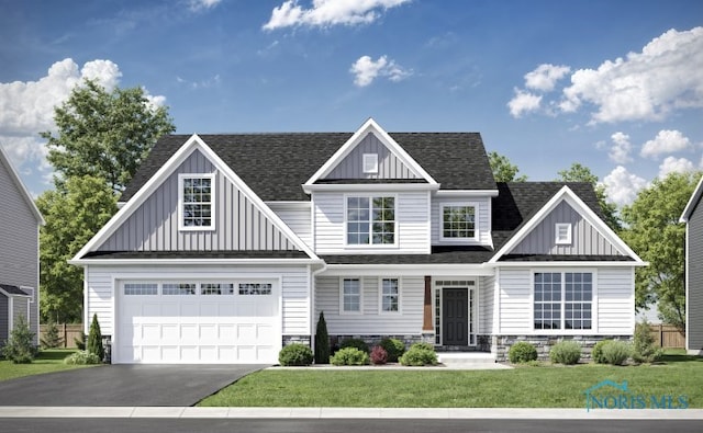 craftsman-style home featuring a garage and a front yard