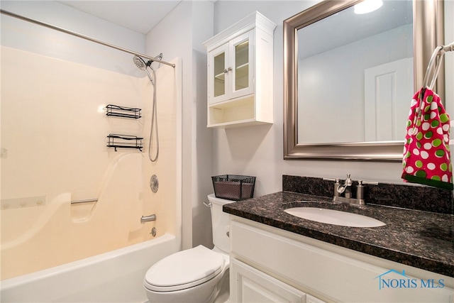 full bathroom featuring toilet, shower / bathing tub combination, and vanity