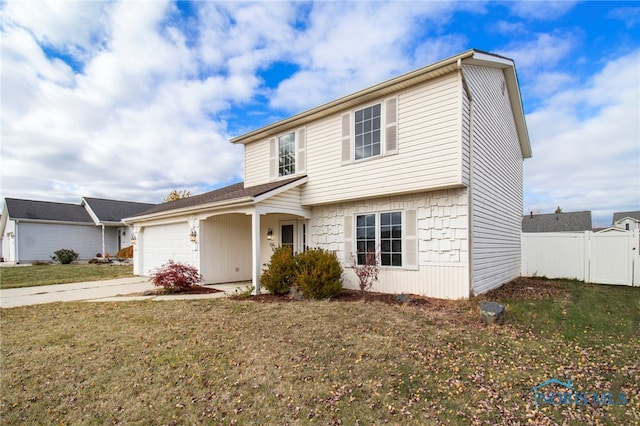 view of front property with a garage and a front lawn