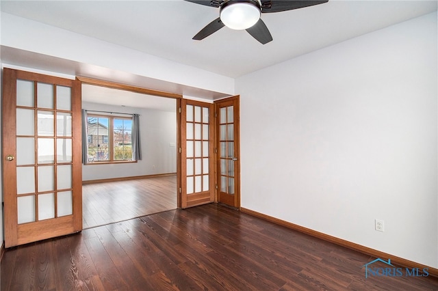 unfurnished room featuring french doors, ceiling fan, and dark hardwood / wood-style flooring