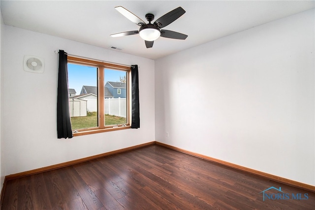 unfurnished room featuring hardwood / wood-style floors and ceiling fan