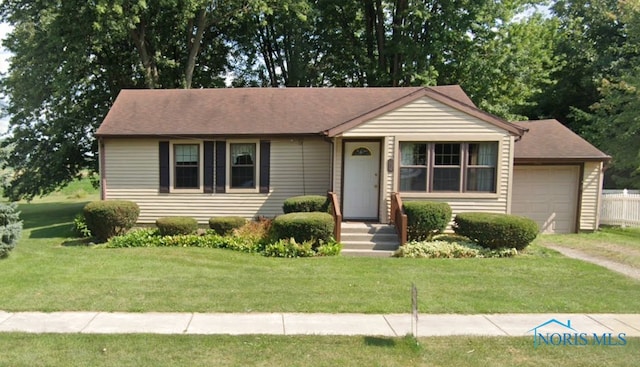 ranch-style house with a front yard and a garage