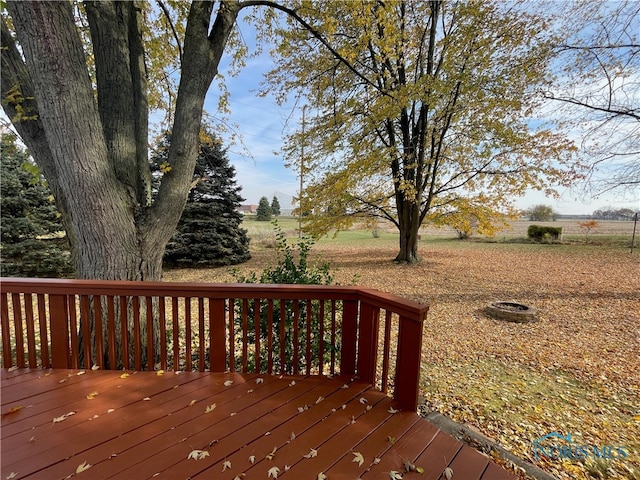 wooden terrace featuring a rural view