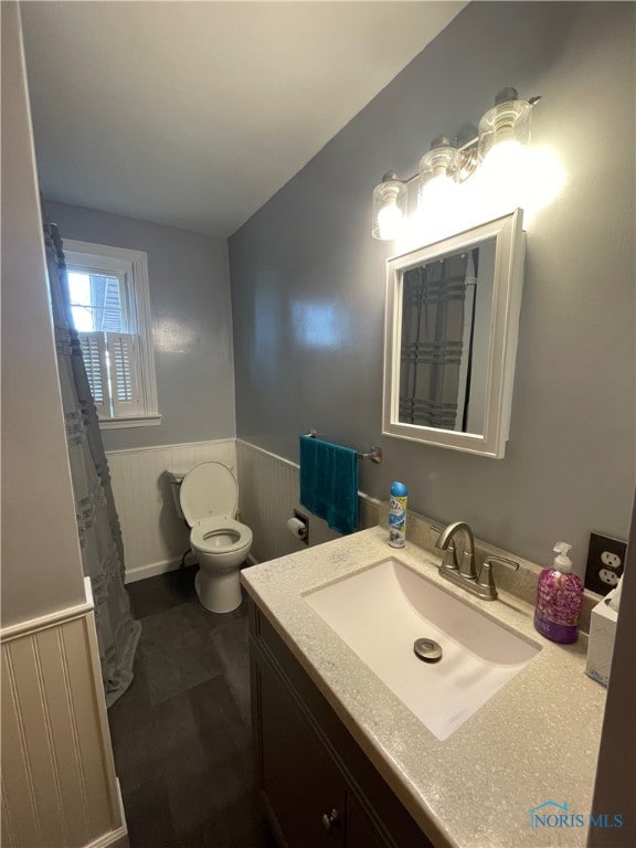 bathroom with vanity and toilet