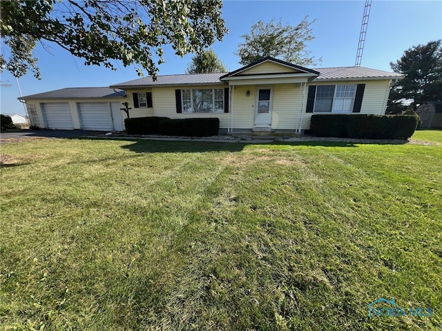 single story home with a front lawn and a garage