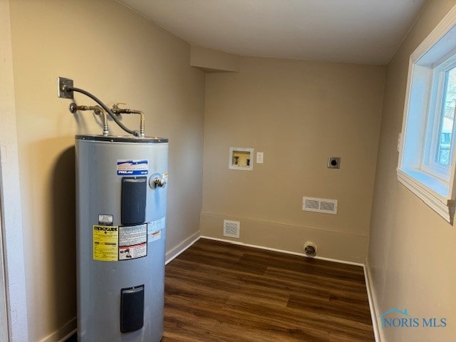 utility room featuring electric water heater