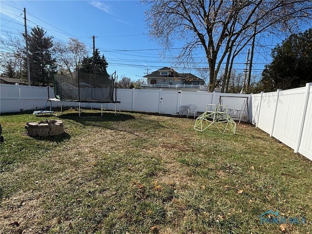 view of yard with a trampoline