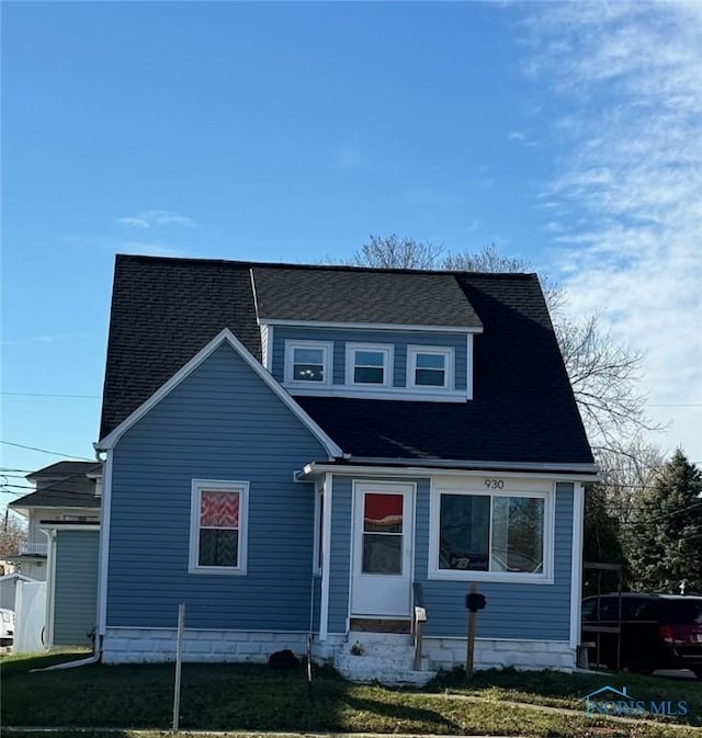 view of front of home with a front yard