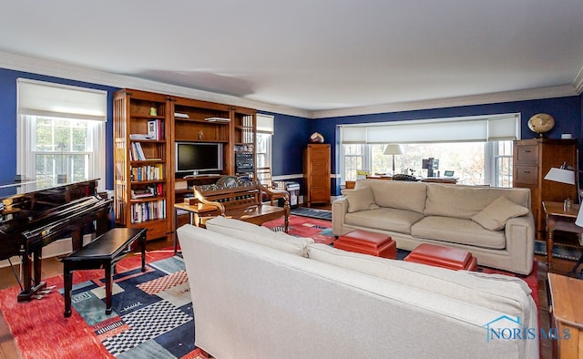 living room with ornamental molding, wood-type flooring, and a wealth of natural light