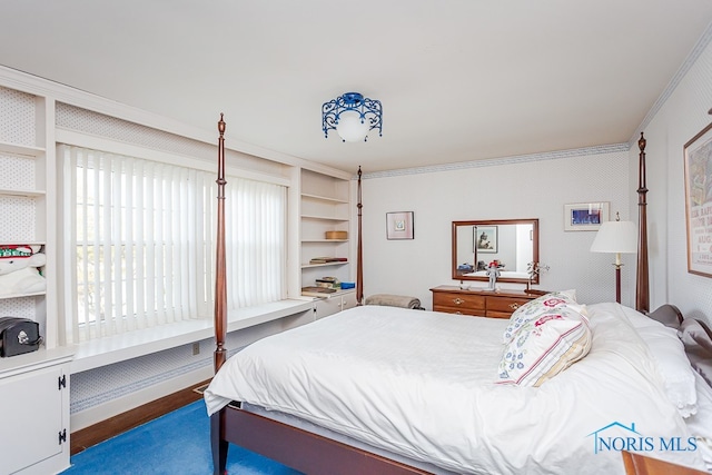 bedroom with hardwood / wood-style flooring