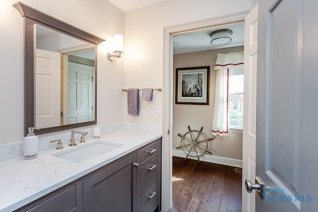 bathroom with vanity and hardwood / wood-style flooring