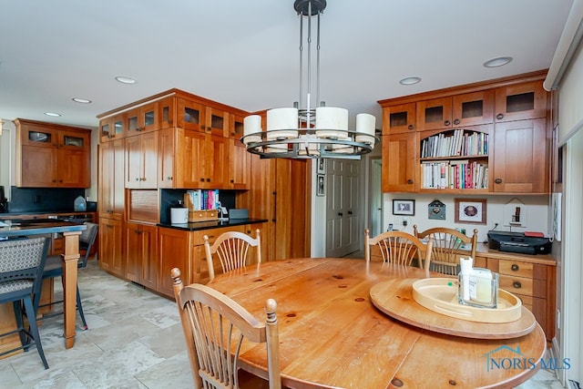 dining space with an inviting chandelier