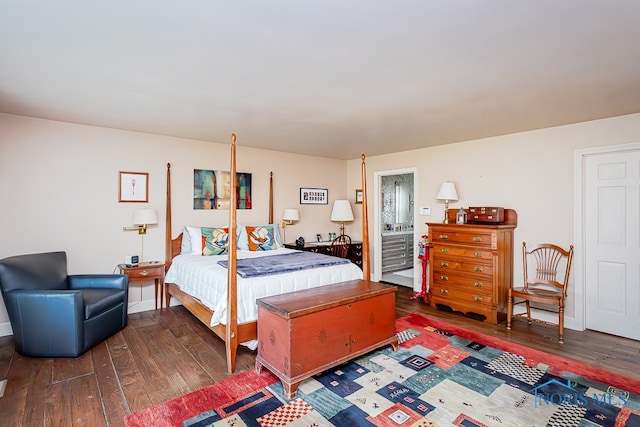 bedroom with dark hardwood / wood-style floors and connected bathroom