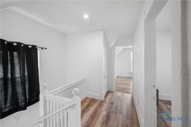 corridor with light wood-type flooring