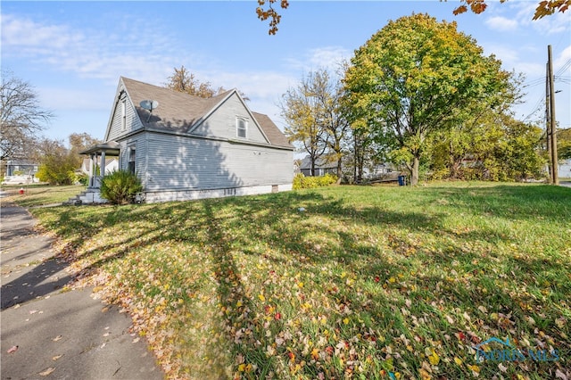 view of property exterior featuring a yard