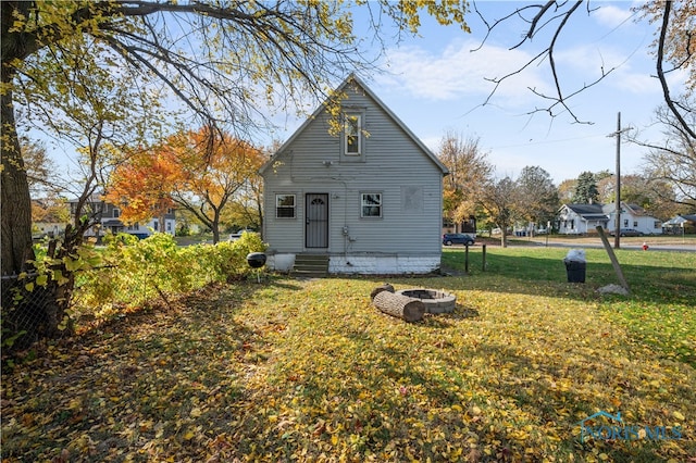 back of property with a yard