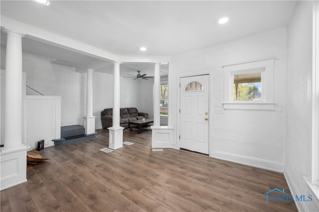 entrance foyer with dark wood-type flooring, a textured ceiling, and ceiling fan