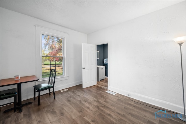 home office featuring dark hardwood / wood-style flooring