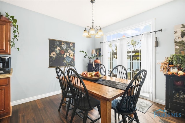 dining area featuring a notable chandelier and dark hardwood / wood-style flooring