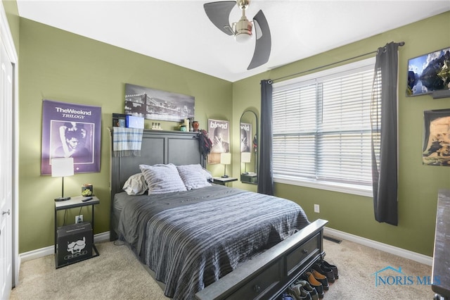 carpeted bedroom with ceiling fan