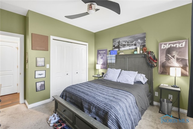 carpeted bedroom with a closet and ceiling fan