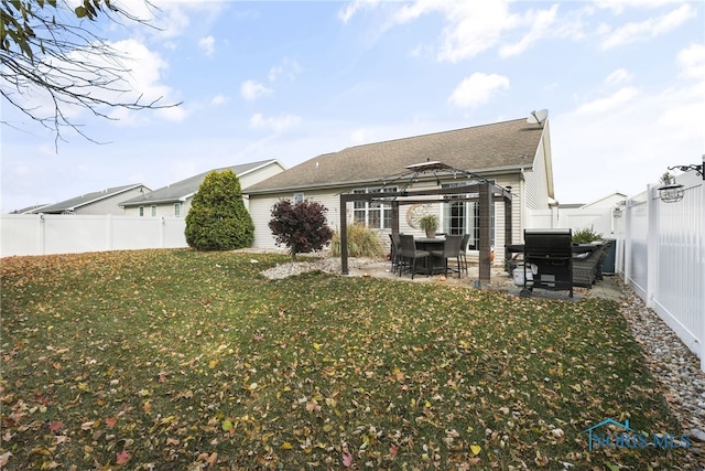 back of house featuring a patio, a gazebo, and a lawn