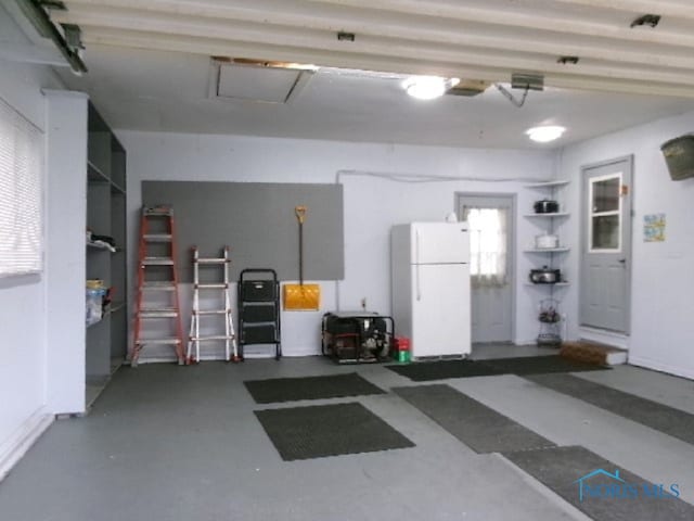 garage featuring white refrigerator