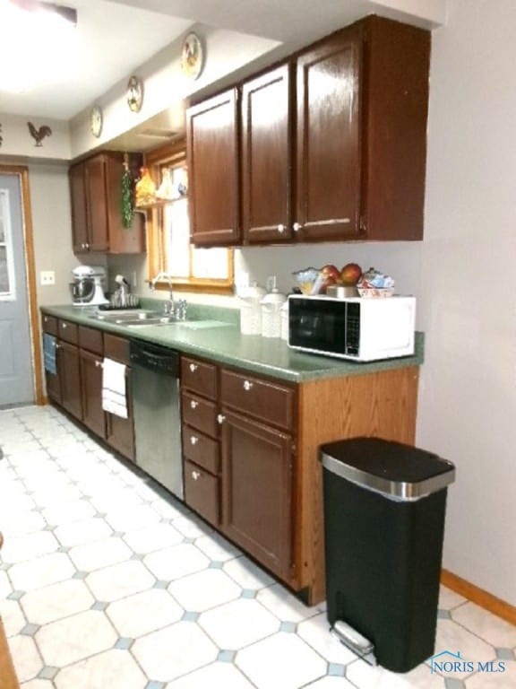 kitchen featuring stainless steel dishwasher and sink