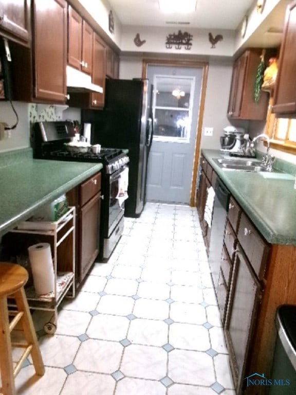 kitchen featuring appliances with stainless steel finishes and sink