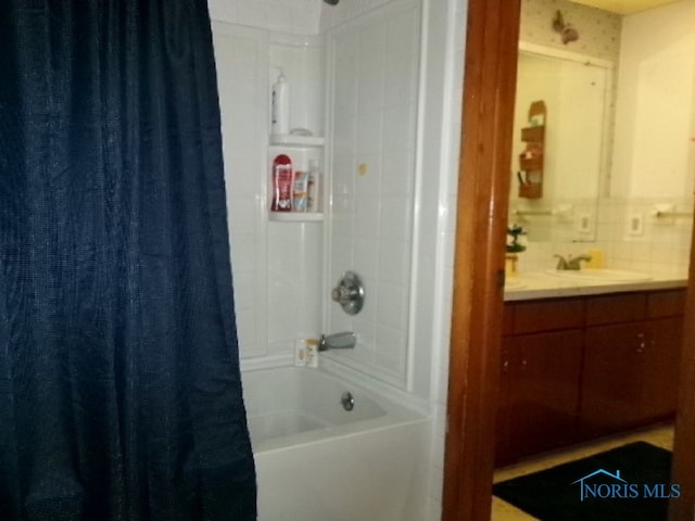 bathroom with vanity and shower / bathtub combination with curtain