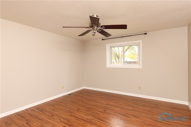 unfurnished room featuring a textured ceiling, wood-type flooring, and ceiling fan