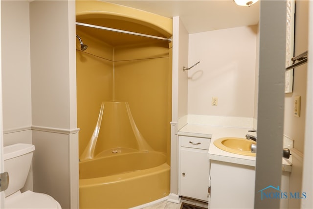 full bathroom featuring toilet, vanity, washtub / shower combination, and tile patterned flooring