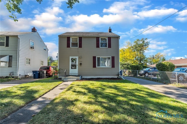 view of front of house with a front lawn