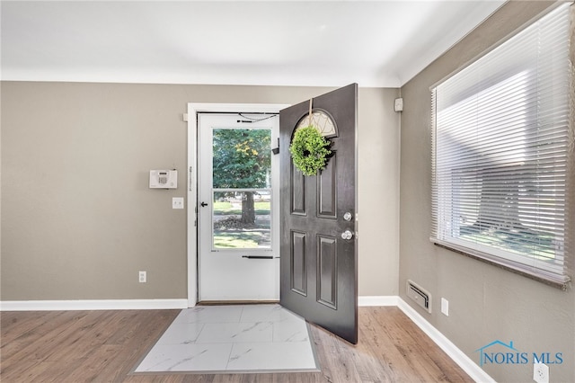 entrance foyer featuring light wood-type flooring