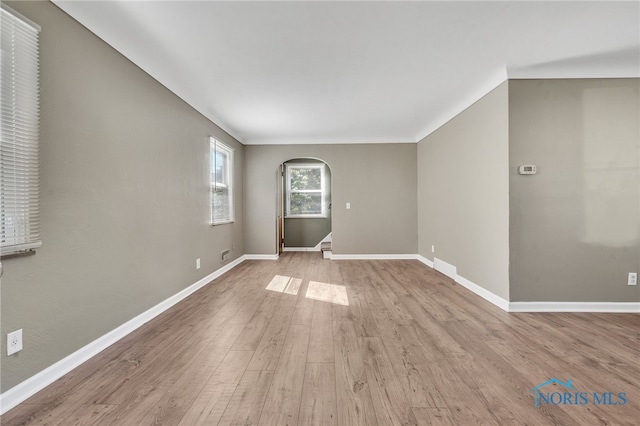 spare room featuring light wood-type flooring