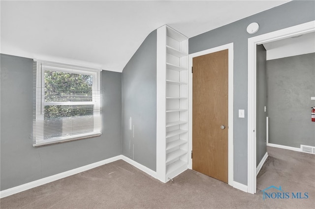 hallway featuring carpet