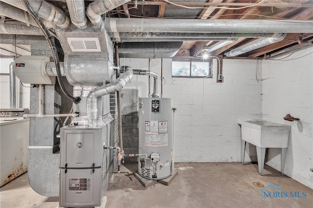 utility room featuring gas water heater