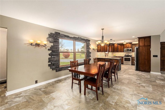 dining room with a chandelier